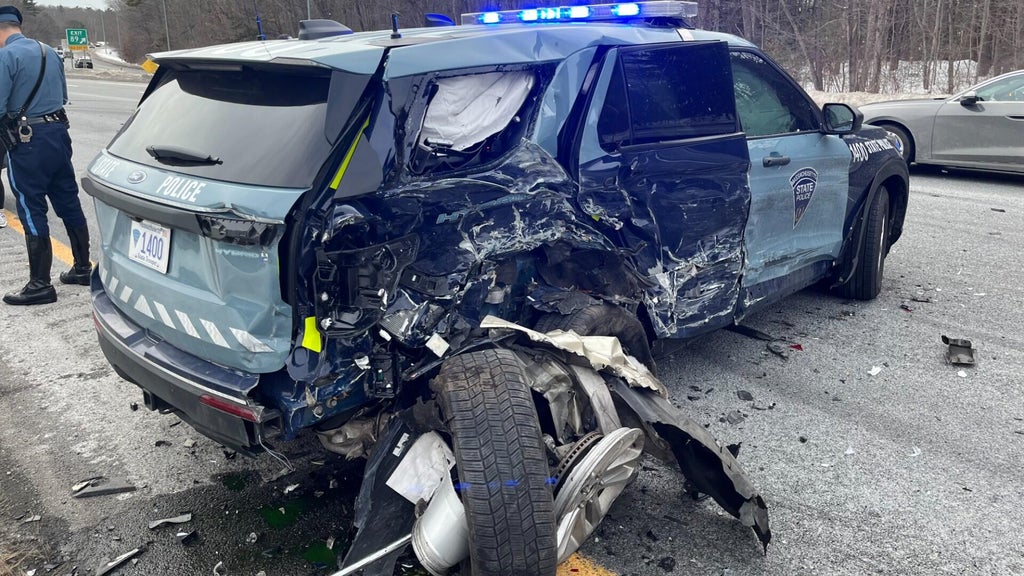 Driver allegedly on phone slams into cruiser, seriously injuring ...