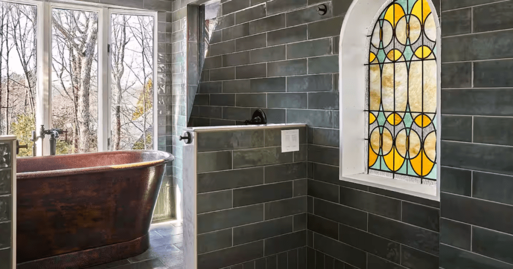 Copper soaking tub in a spa-like bathroom at a Swiss-style unique Airbnb in North Kingstown, Rhode Island.