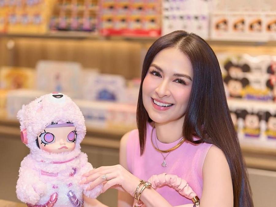 Marian Rivera poses with a new toy figure at store opening