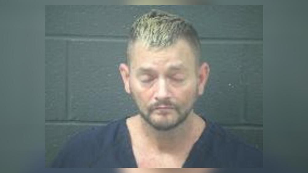 Man arrested after allegedly holding 2 people hostage during robbery ...