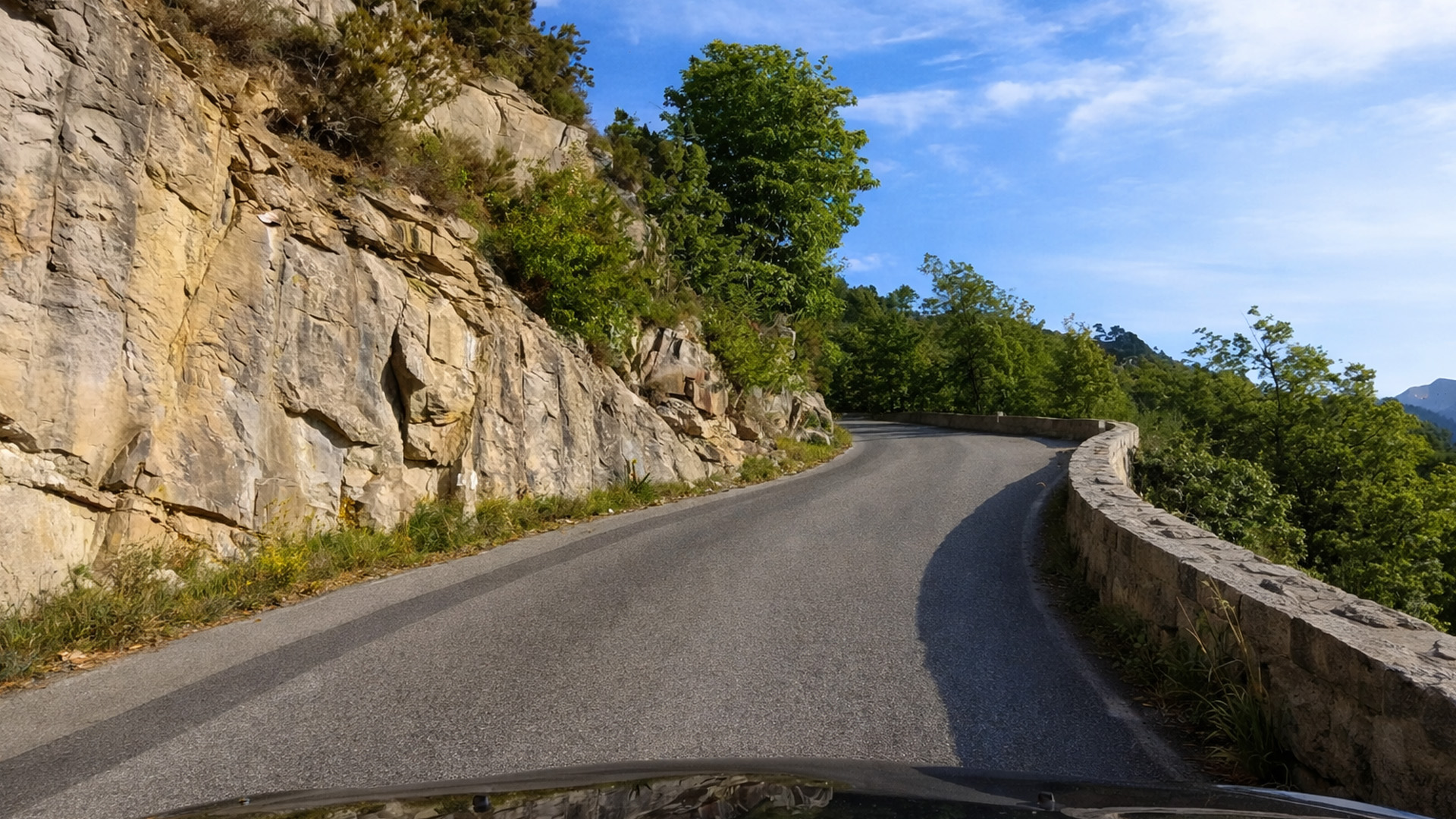 Driving along a mountain road in the French Alps