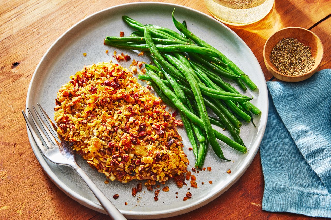 Honey Pecan Chicken on a plate to serve with green beans on the side