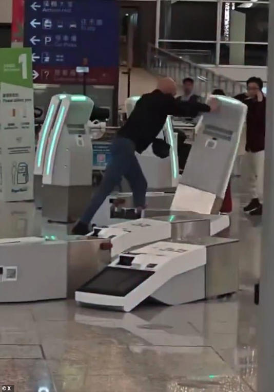 The British man, 35, pushed check in kiosks during his fiery tantrum at Hong Kong airport