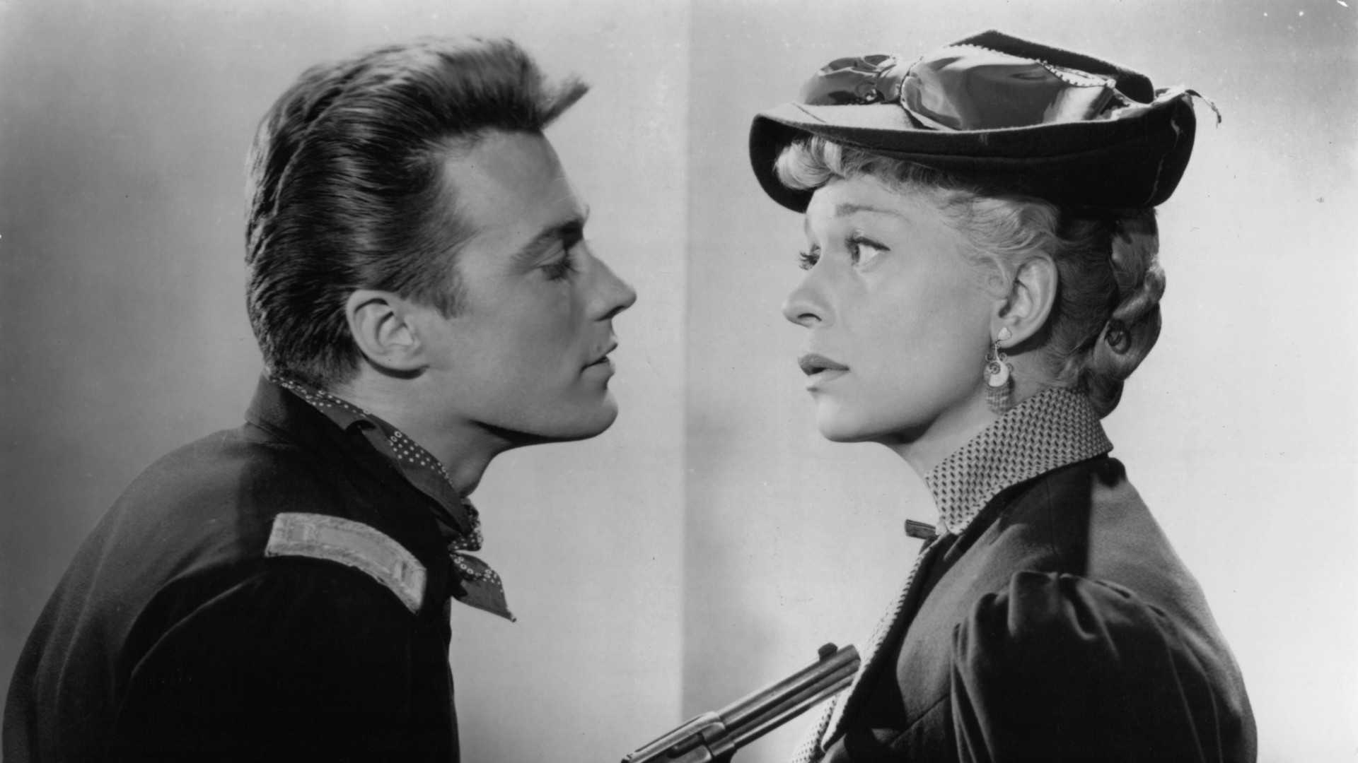 Clint Eastwood points a pistol at Ginger Rogers in a promo image for The First Traveling Saleslady