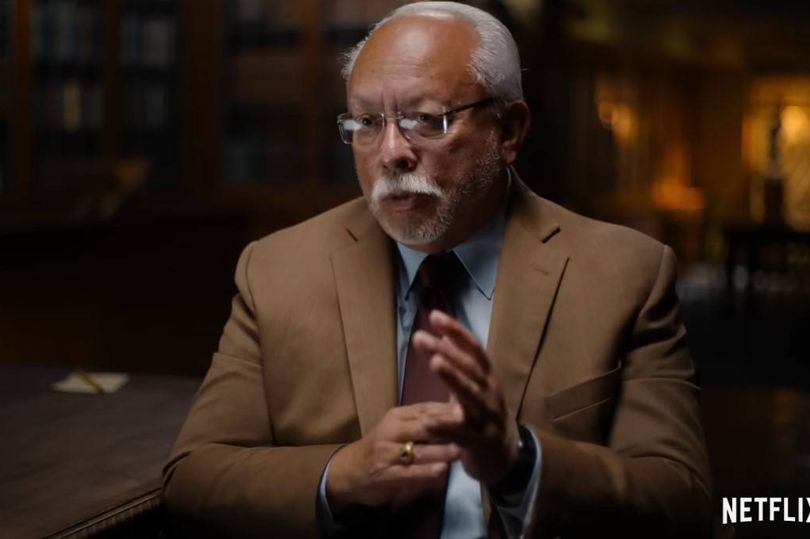 A man in a brown jacket