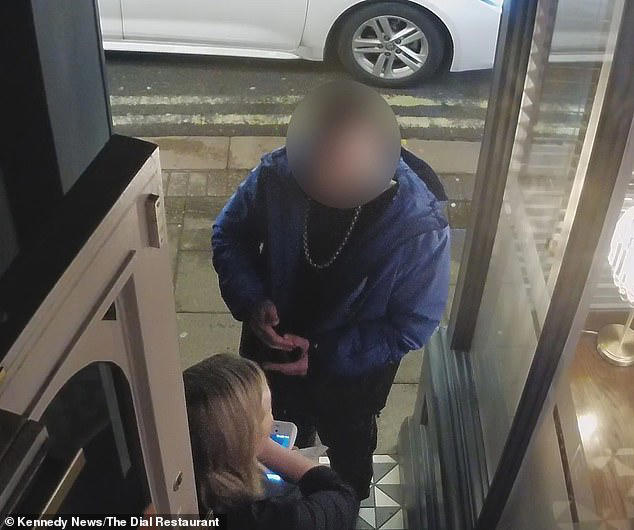 Moment diner appears to pluck hair from his head to put it in meal ...