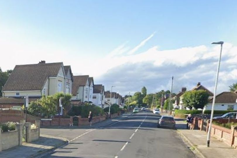 Road closed after car smashes through wall, front garden and into bay ...