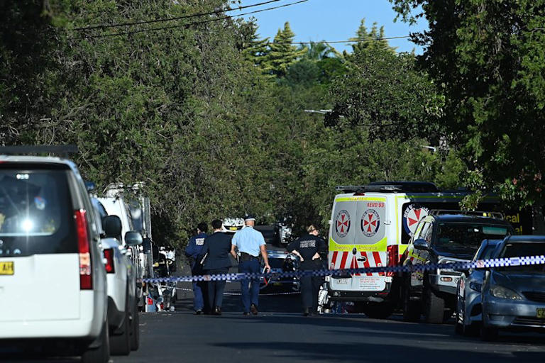 Police and paramedics at the scene where former NRL star Matt Utai was shot in Greenacre.