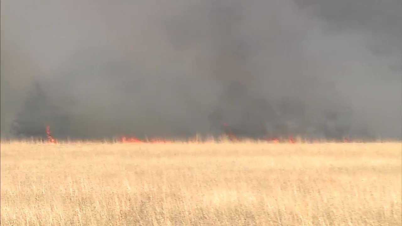 Grass fire south of Cedar Valley causes heavy smoke to fill sky