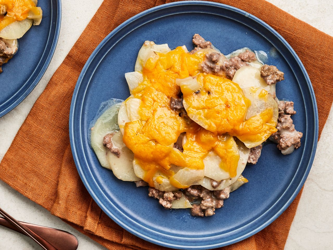 Plated hamburger potato casserole with cheese