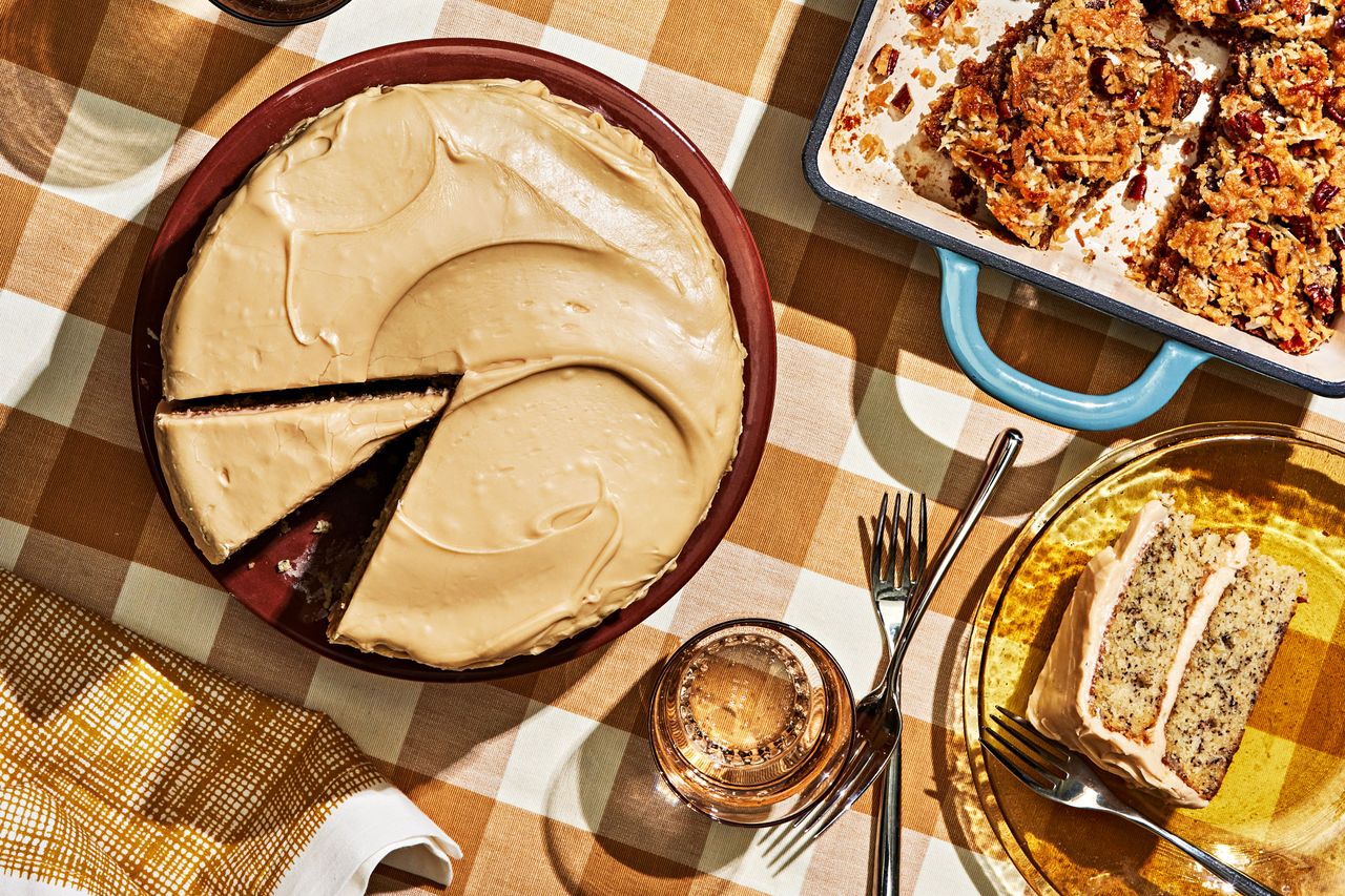 Southern Living Banana Layer Cake With Caramel Icing on a platter to serve with a piece cut
