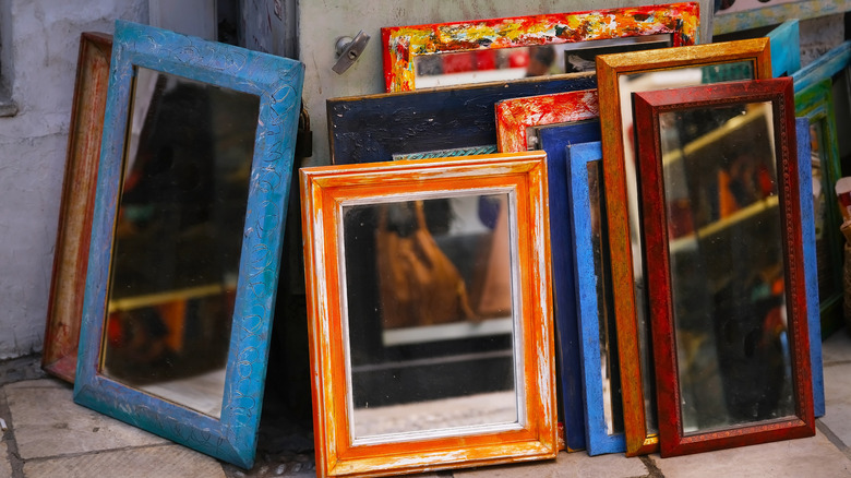 Upcycle an old frame into the cutest DIY wall decor storage shelf