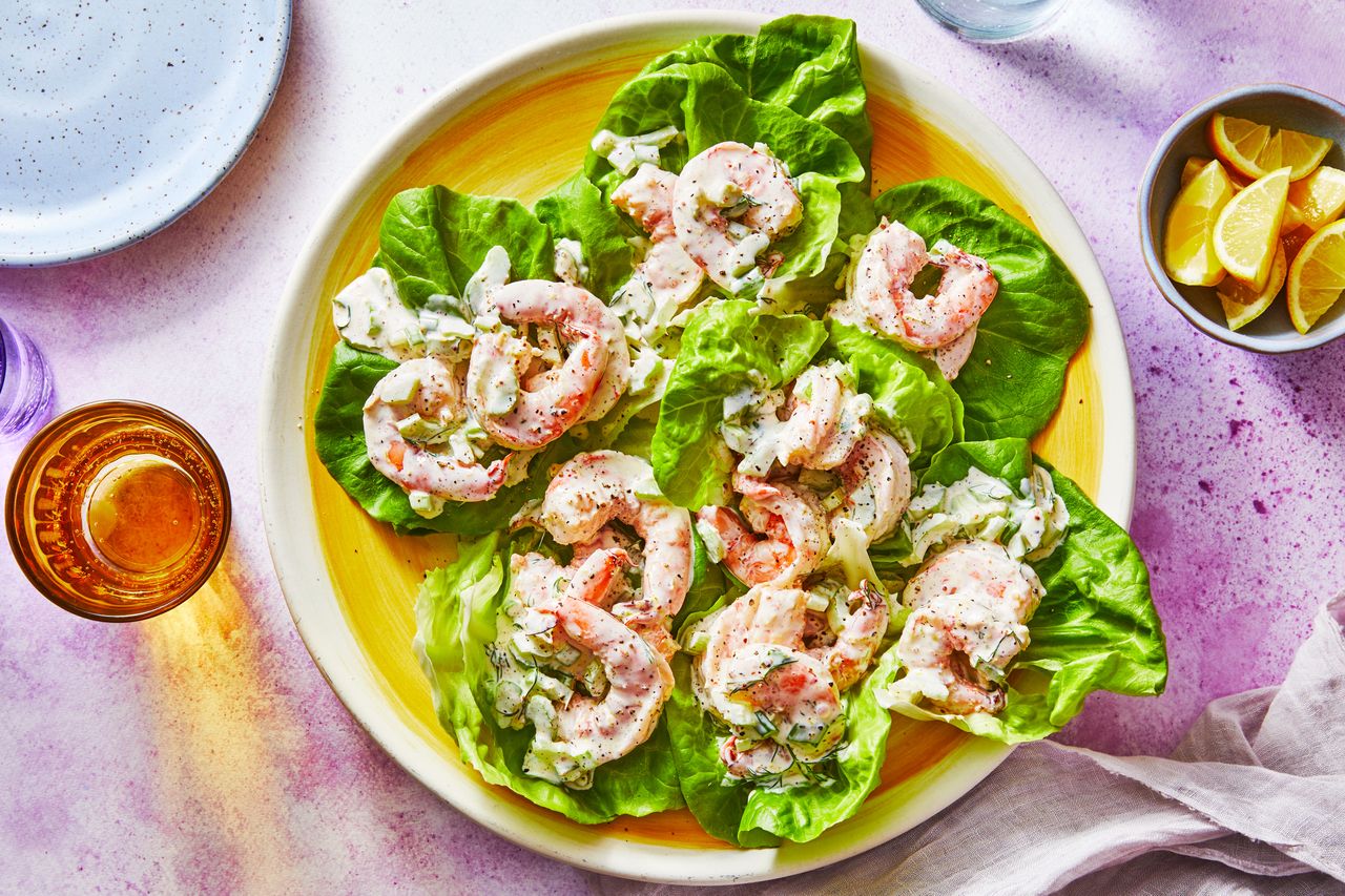 Southern Living Shrimp Salad on a platter to serve with a glass of beer and lemon wedges
