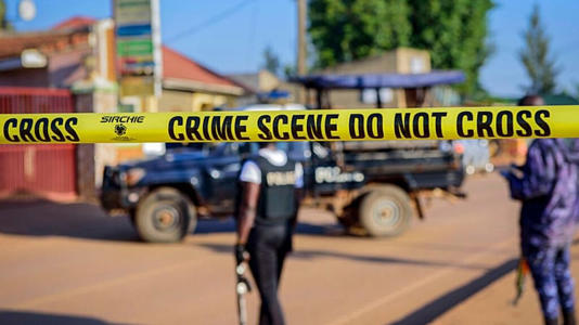 Police secure a road leading to the scene of an explosion in the Komamboga suburb of the capital Kampala, Uganda Sunday, Oct. 24, 2021.