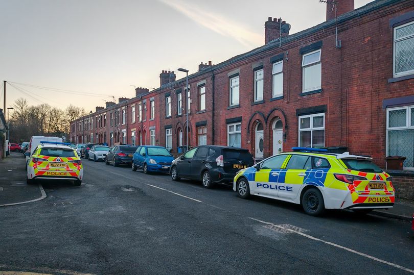 Police storm homes at dawn and arrest two men after horror Oldham shooting