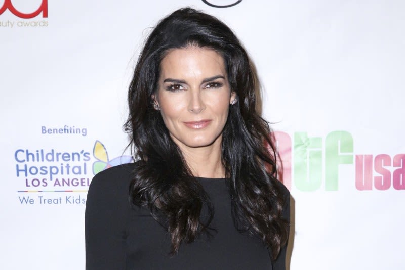 Angie Harmon is back with beau from her teen years