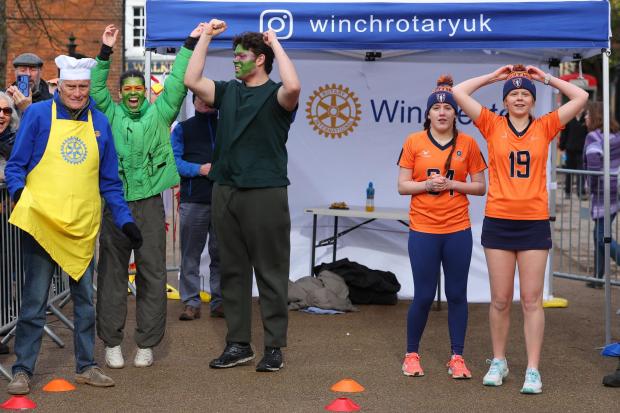 Pancake racing returns to Winchester as hundreds spectate outside cathedral