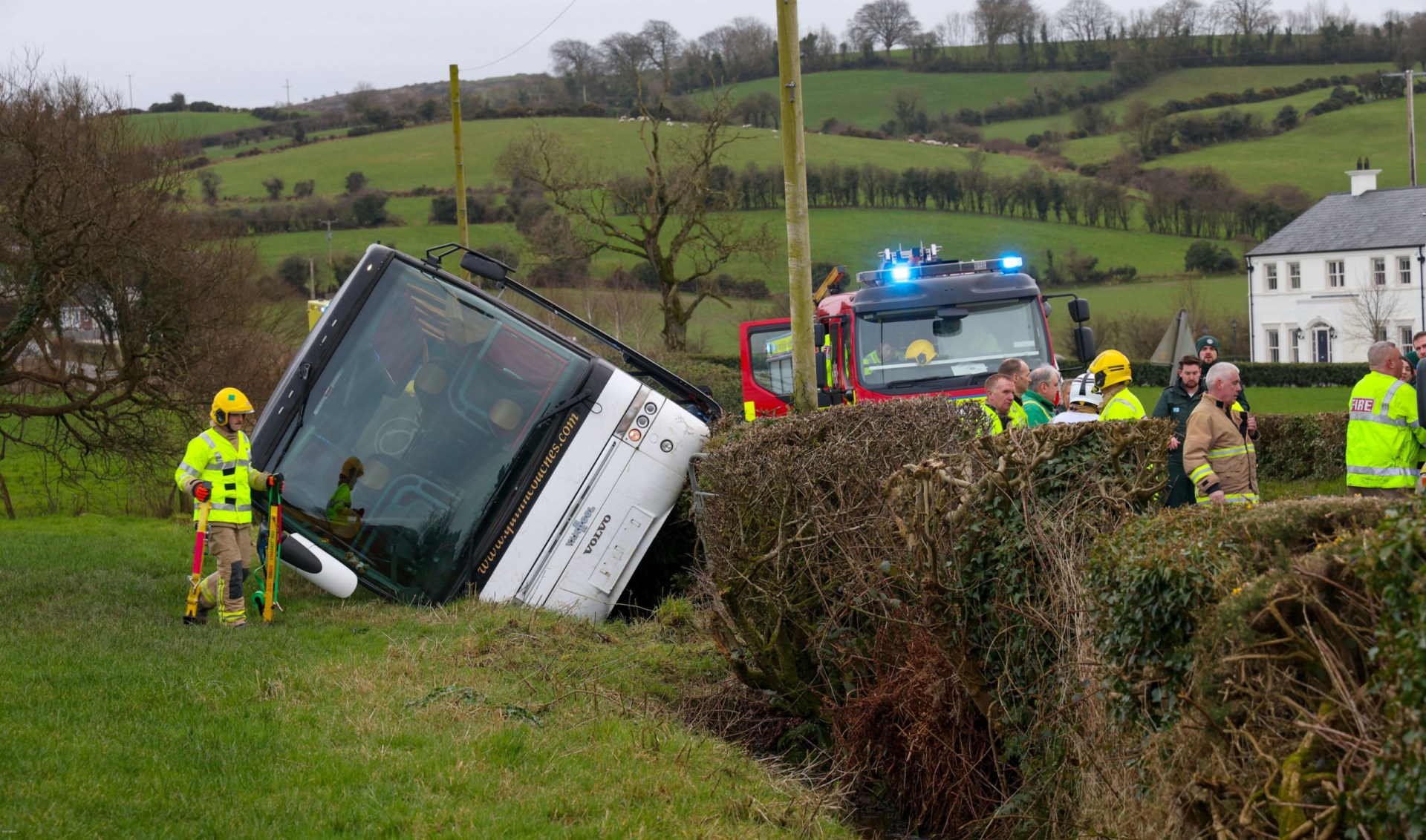 School bus carrying 40 children veers off-road and crashes