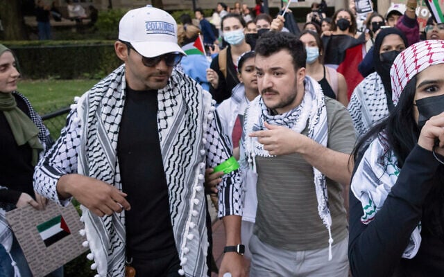 Mahmoud Khalil, right, and fellow anti-Israel activist Mohsen Mahdawi, left, participate in a protest at Columbia University, October 12, 2023, in New York. (AP/Yuki Iwamura)