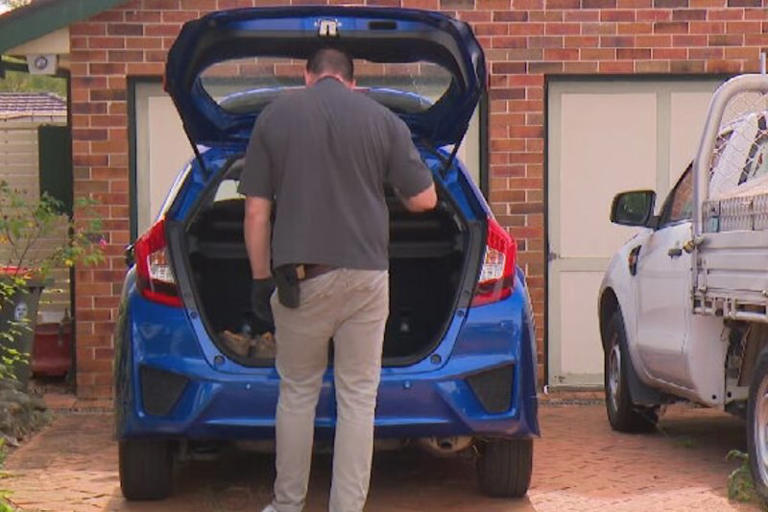 Detectives search a Castle Hill property on Wednesday morning.