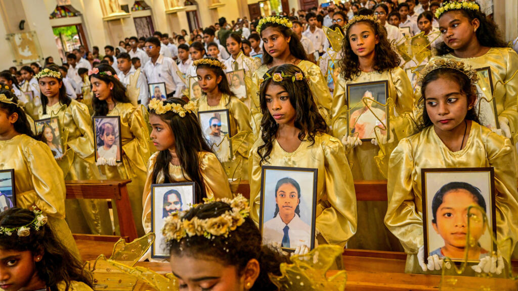 Children carrying portraits of the 2019 Easter Sunday bombing victims in Sri Lanka, marking the sixth anniversary on April 21, 2025.