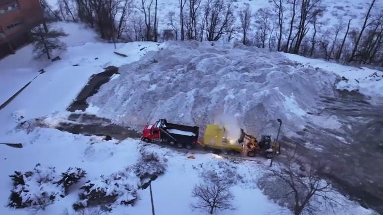 Snow piling up at Boston's 'snow farms' as students return to school in ...