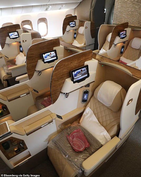 An Emirates Airlines business class cabin is pictured. The airline is one of two that offers both first and business class cabins on direct flights between New York JFK and Milan Airports
