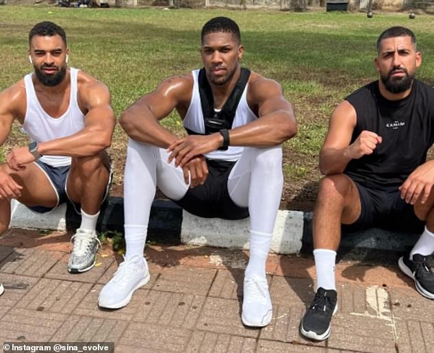 Joshua pictured with Latif Ayodele (left) and Sina Ghami (right)