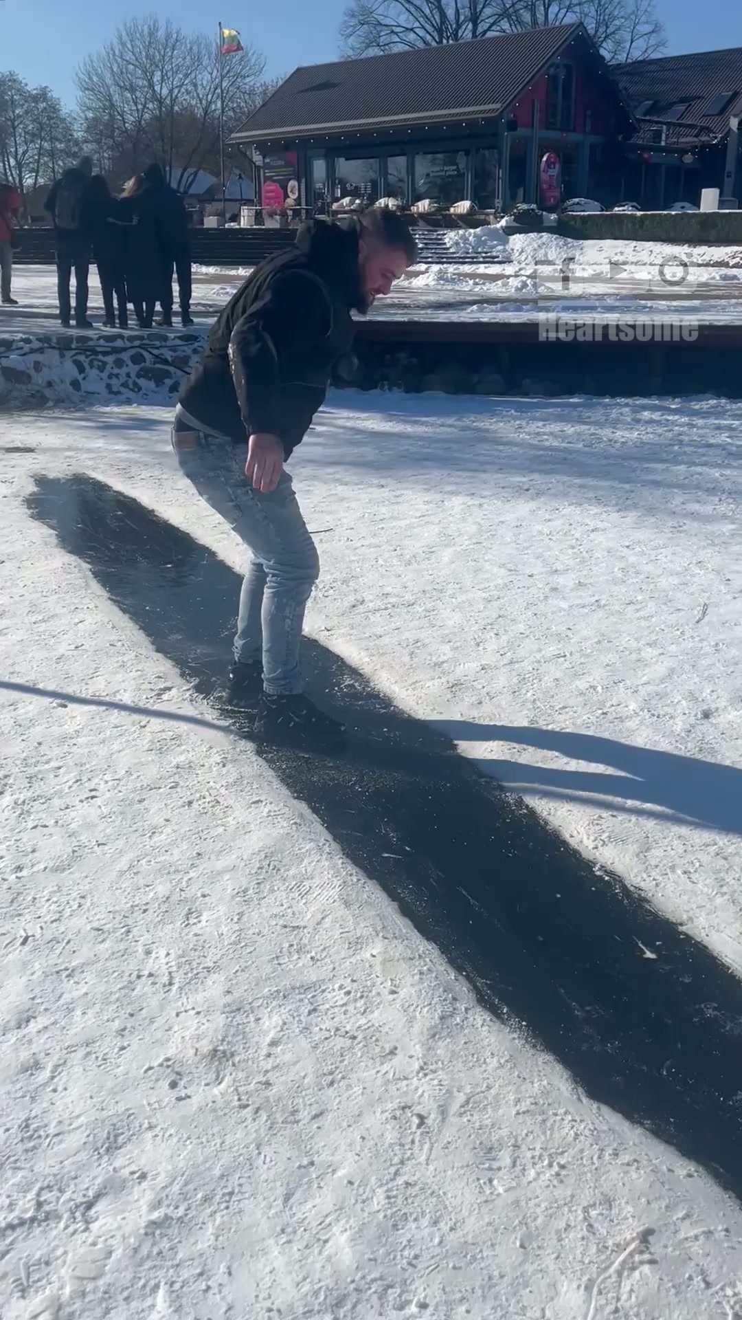 Epic ice fall caught on camera: Man slips and cracks the surface