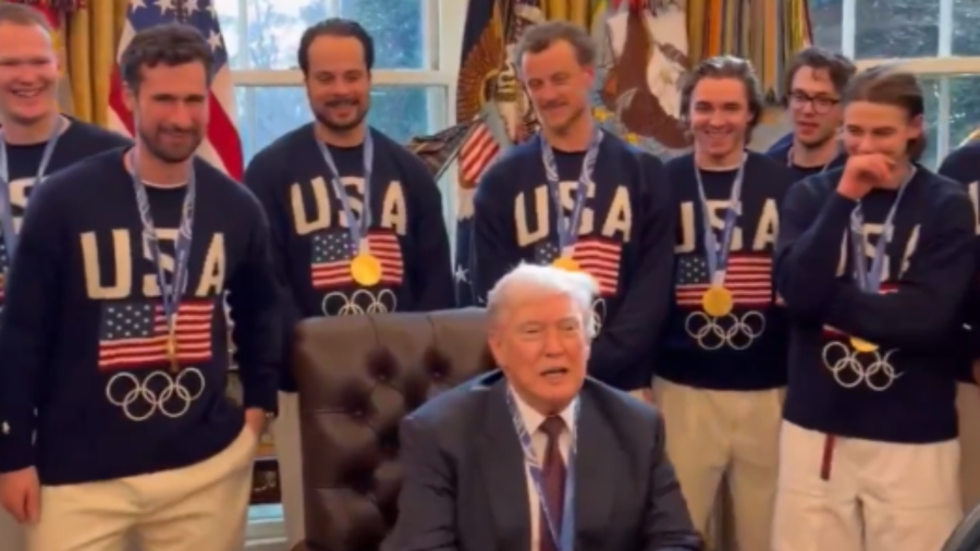 President Trump tries on gold medal as US hockey team visits White House