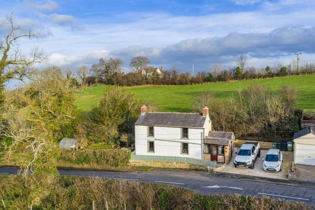 Cumbrian 19th century cottage with wood panelling and gardens for sale