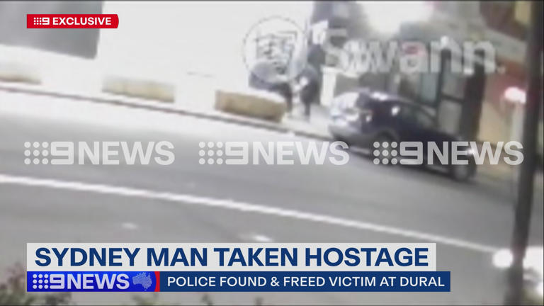 The man was bundled into a hatchback early on Tuesday morning.