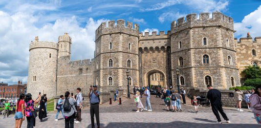 Tourists Taking Photos Outside Windsor Castle in England