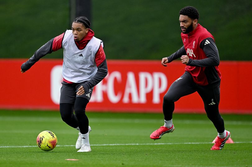 Rio Ngumoha and Joe Gomez of Liverpool during a training session at AXA Training Centre on February 26, 2026 in Kirkby, England