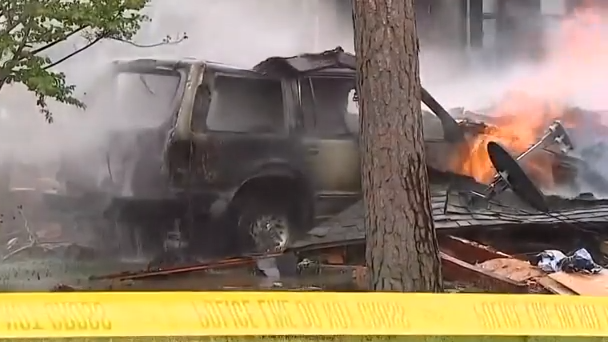 Seconds after police arrived - the house exploded on camera