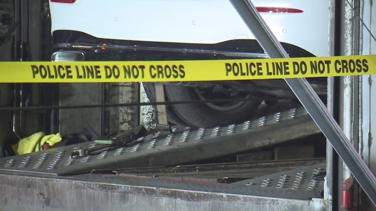 Man dies after becoming trapped in car hauler
