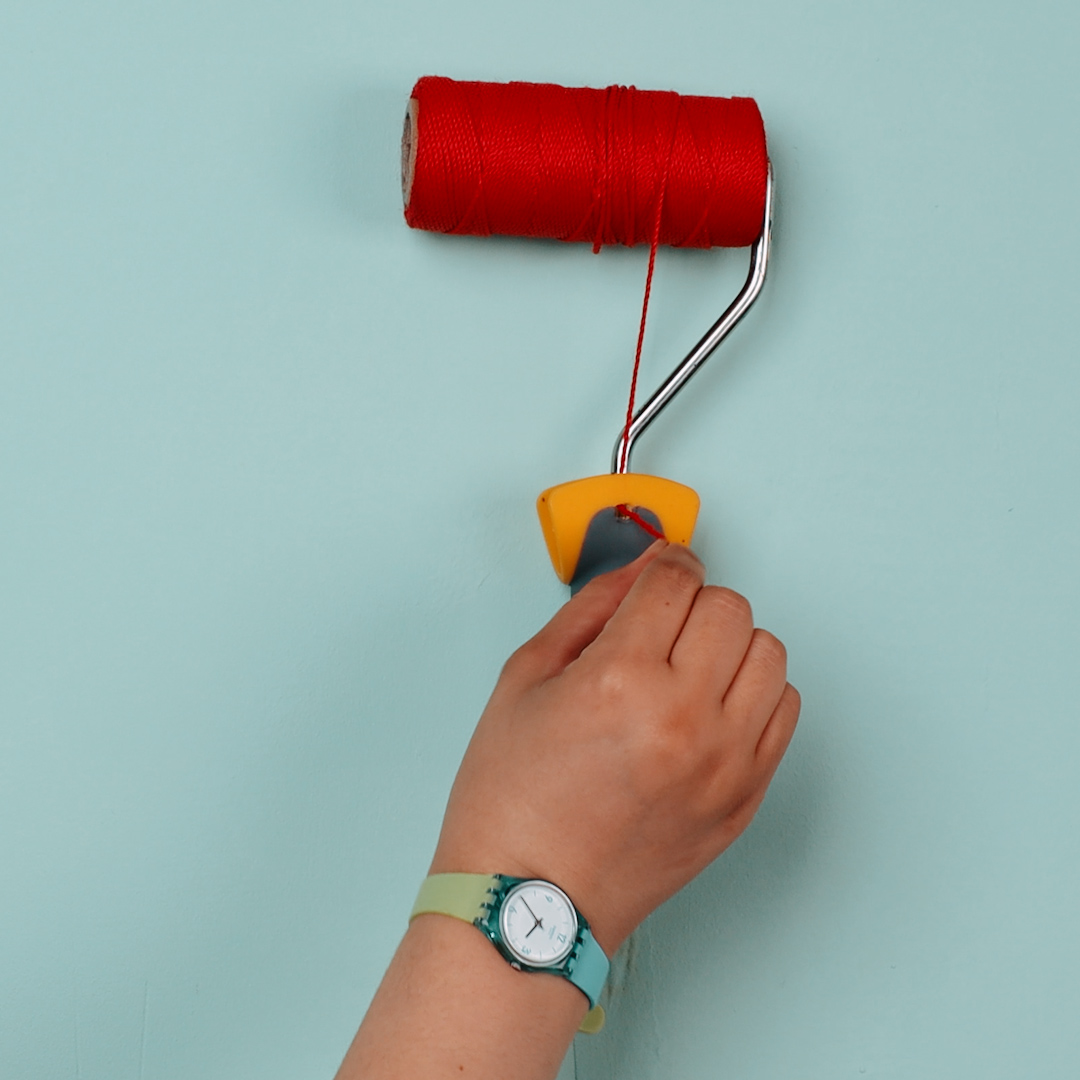 Make a thread spool holder into a painting roller