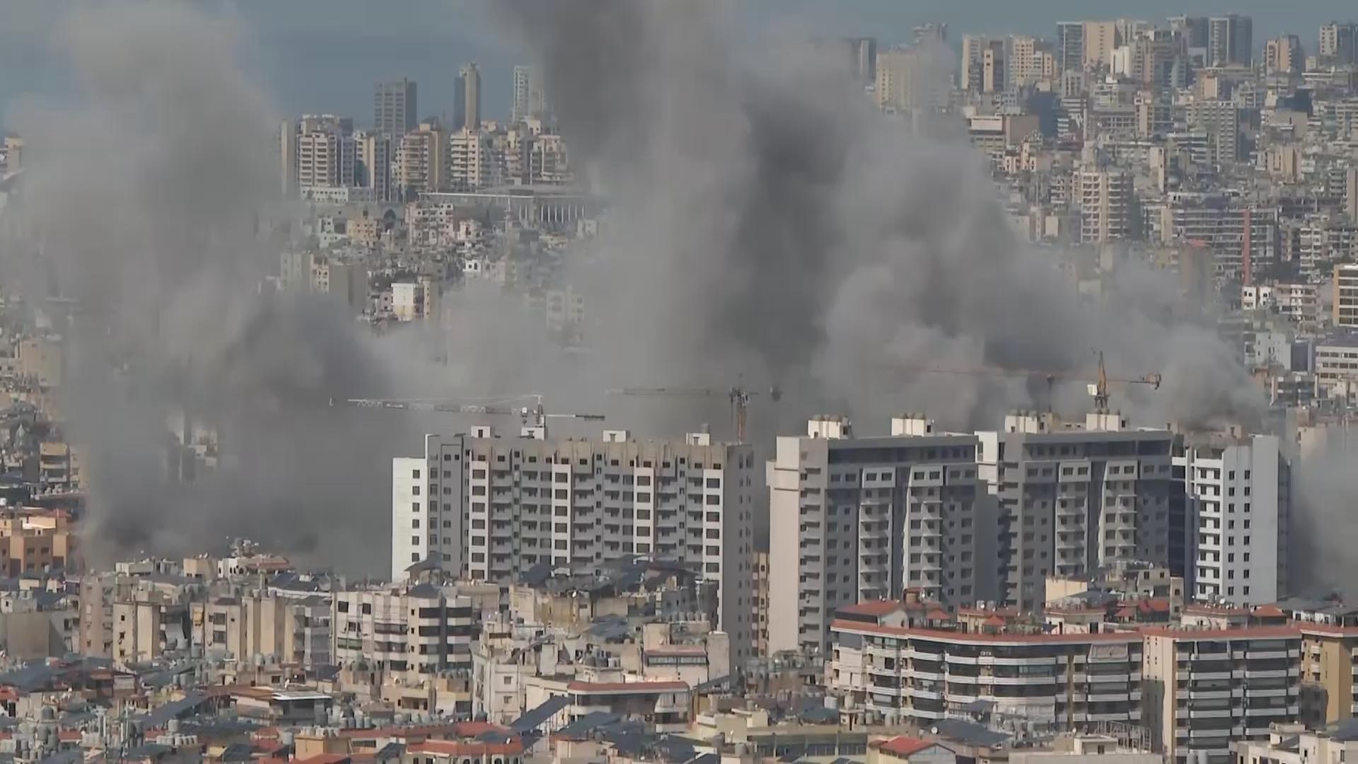 Explosion and plumes of smoke rising in Beirut following Israeli strike