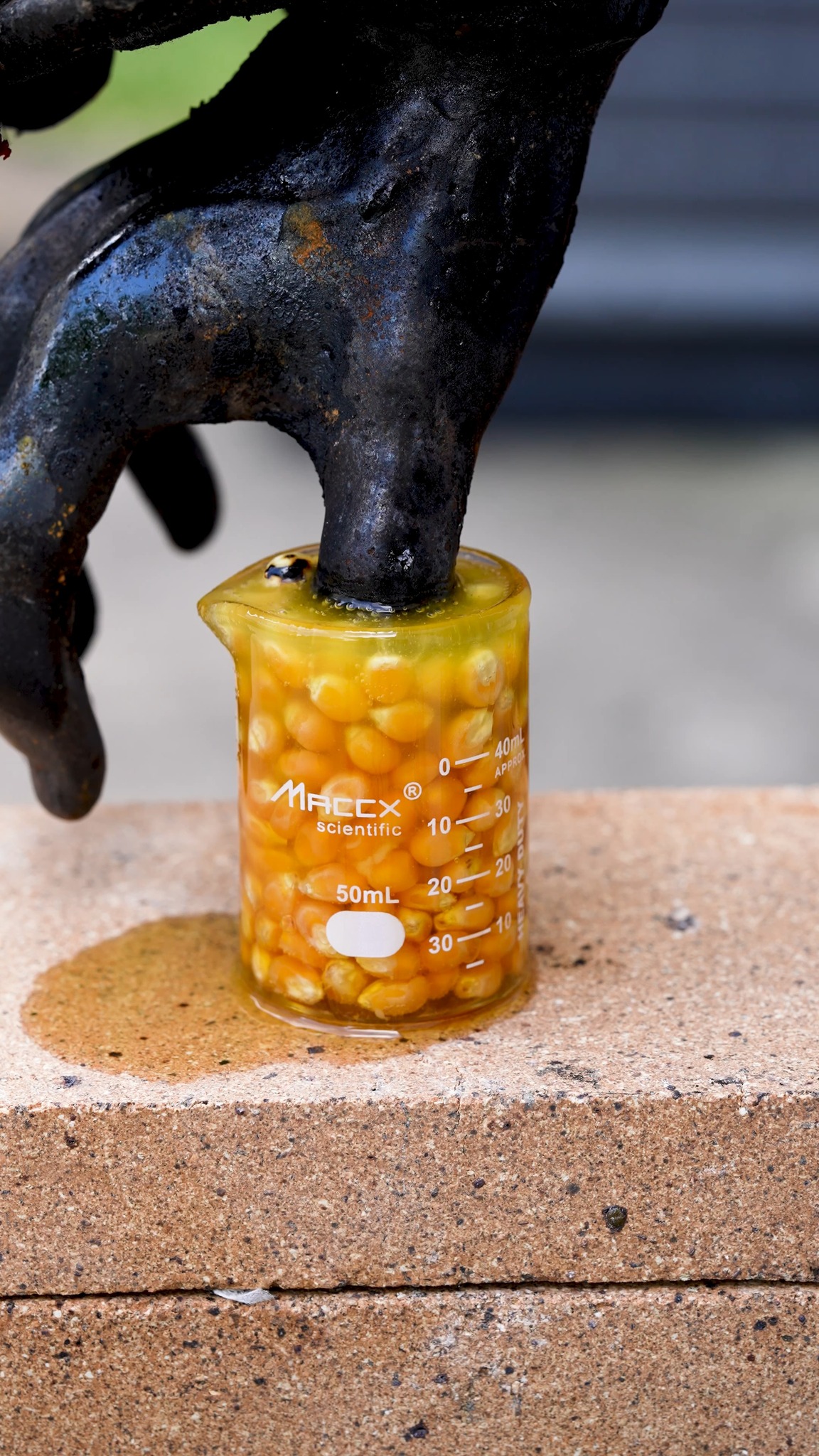Hand of God vs popcorn in beaker