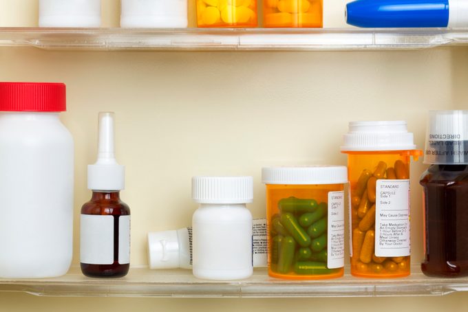 Medications On The Shelves Of A Medicine Cabinet