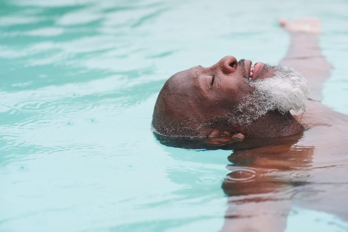 A Mature Man Relaxes In A Pool