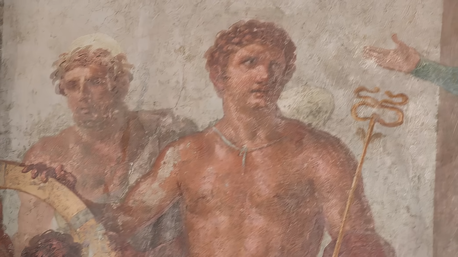 Why early Christian art often shows Jesus holding a wand-like staff