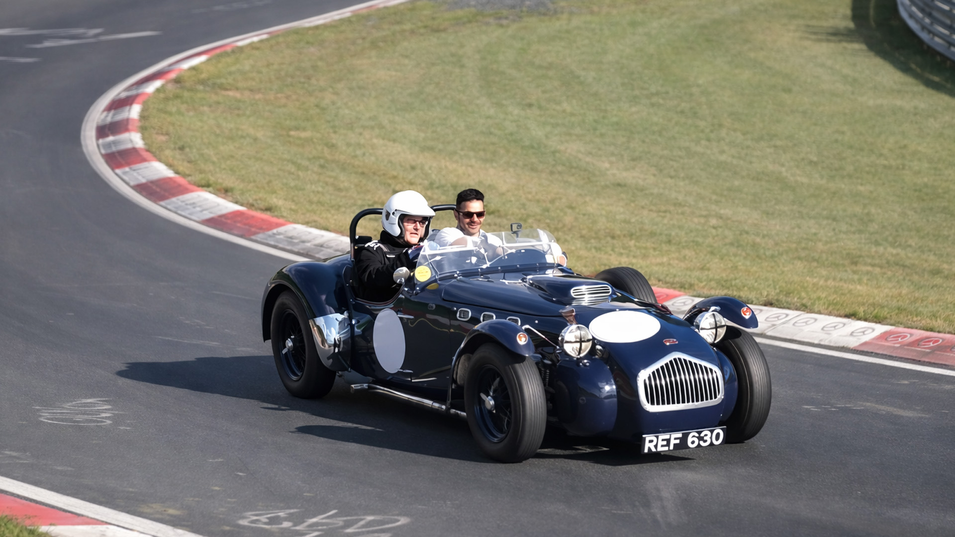 Classic open top racer pushing through corners Nürburgring Nordschleife