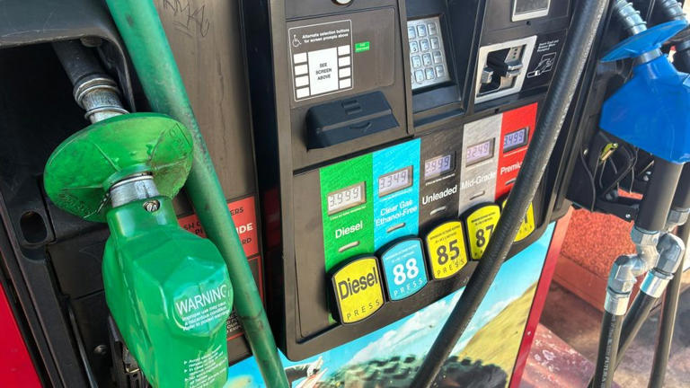 Gas station price sign showing $4.16 per gallon