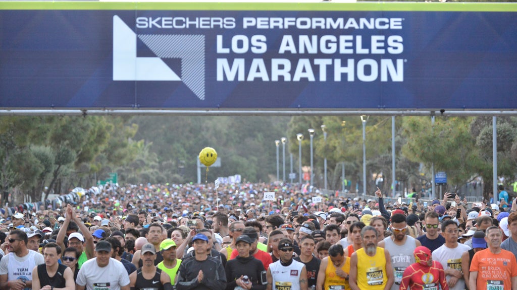 Los Angeles Marathon awarding medals to runners who complete 18 miles