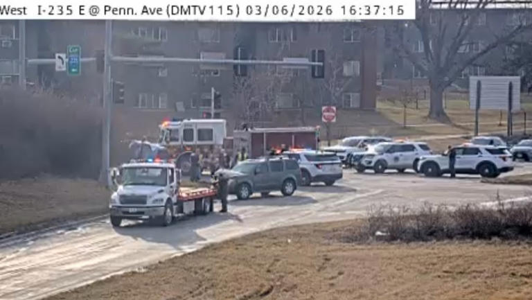 Minor injuries reported after car rolls along I-235, DMPD on scene