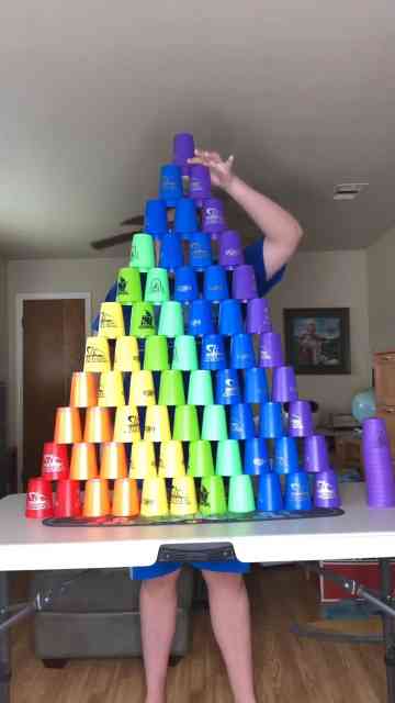 Man shows his cup stacking skills and it is oddly satisfying