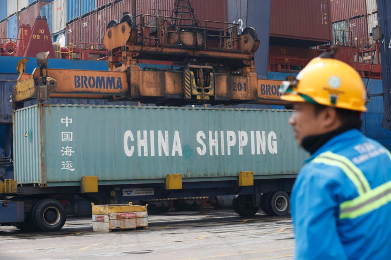 A worker at the Jakarta International Container Terminal in Indonesia. Photo: EPA