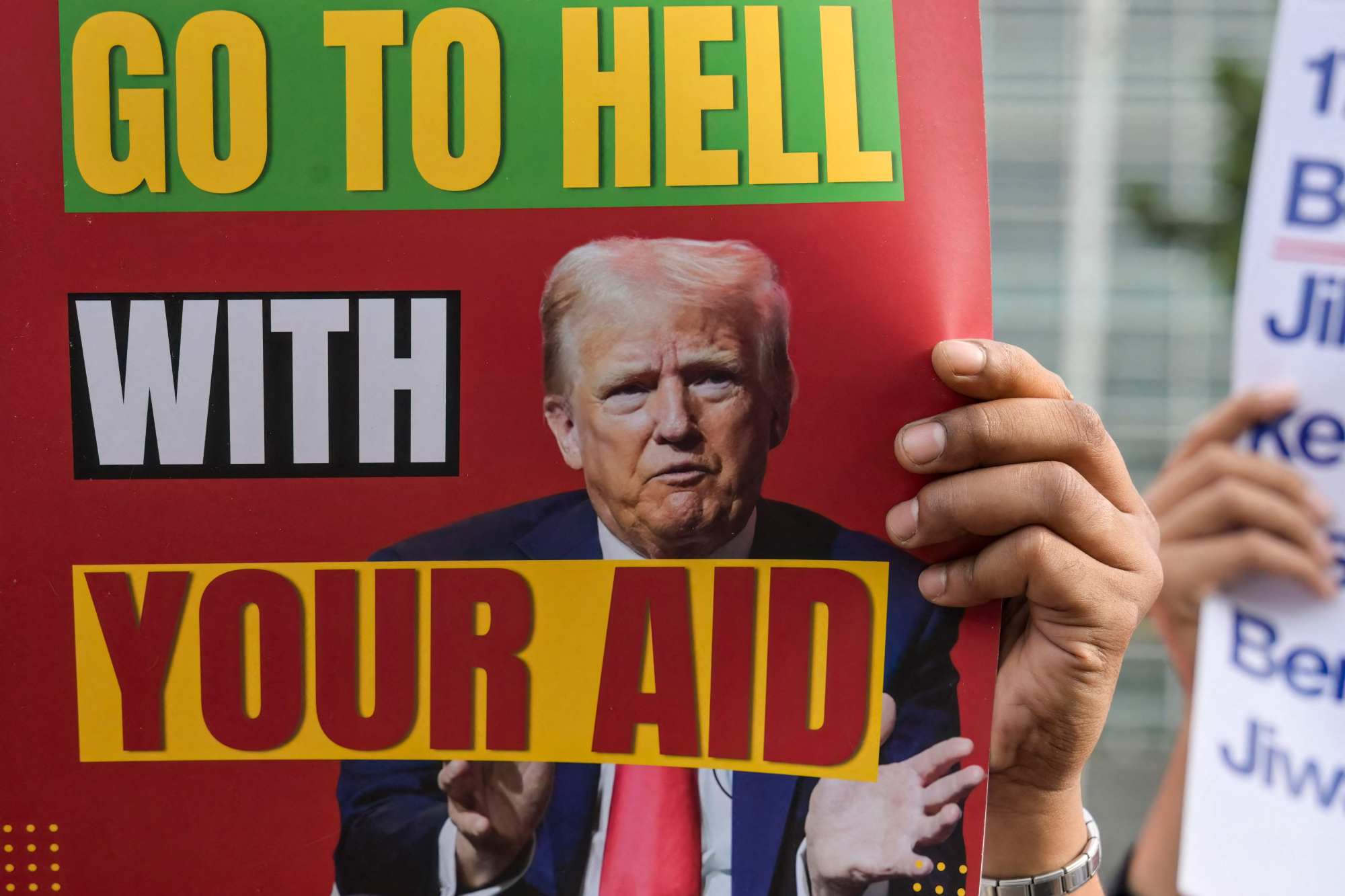 A protester holds a placard during a demonstration condemning US and Israeli attacks on Iran and Palestinians in front of the US embassy in Jakarta on Tuesday. Photo: AFP