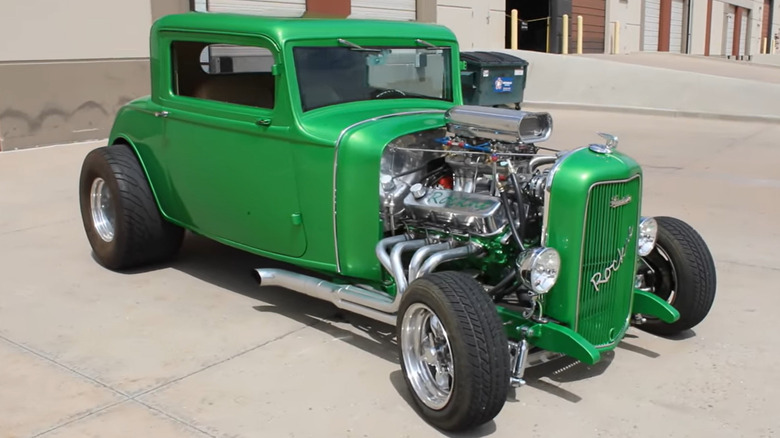 Front-quarter view of a bright green Studebaker Rockne three-window hot rod